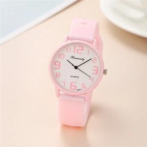 Close-up of pink silicone watch featuring white dial and vibrant pink numerals
