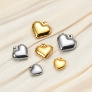 Polished heart-shaped stainless steel pendants in gold and silver colors for DIY jewelry