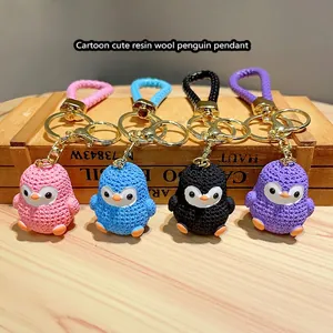 Cute resin cartoon penguin keychains with knitted texture in pink blue black and purple