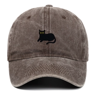 Close-up of black cat embroidery on brown washed cotton vintage baseball cap
