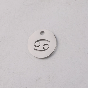 Macro view of 12mm mirror polished stainless steel Cancer zodiac sign hollow pendant