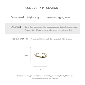 Detail view of colorful zircon open bangle showing copper base and 6cm x 5.7cm dimensions