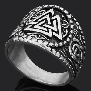 Macro view of vintage Viking Valknut ring in stainless steel with nordic carvings