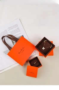 Premium orange jewelry gift set including paper bag and boxes with brown velvet interior