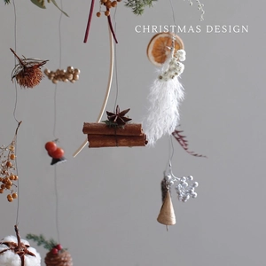 Christmas ornament with cinnamon sticks and dried fruits for rustic tree decoration