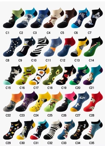 Grid display of 35 diverse patterned low-cut socks with art, food, and animal prints