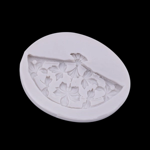 White silicone mold featuring a detailed Chinese fan pattern with flowers and bows