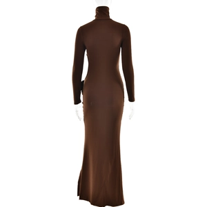 Detail showing the back of the brown high-neck slim fit maxi dress with a cutout design