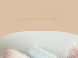 Close-up of tweed strawberry cake pencil cases in pink and blue with textured fabric