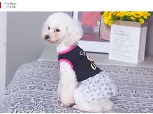 Detail of dog dress with black knit top and starry white mesh skirt on a pet model