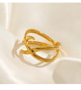 Macro shot of 18K gold plated stainless steel ring with unique geometric overlapping design