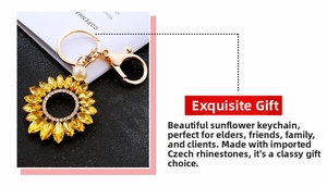 Detail of sunflower keychain featuring yellow crystals and a white pearl accent
