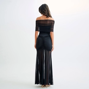 Rear view of black tube long dress featuring mesh stitching and ruched hip details