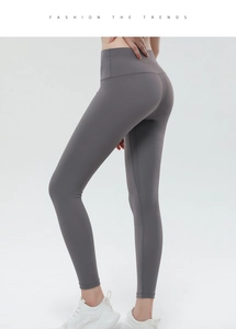 Detail view of dark grey high-waisted yoga leggings with seamless peach lift and matte texture