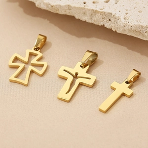 Detailed close-up of three gold stainless steel cross pendants in various minimalist designs