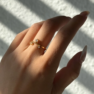 18k gold plated open ring with snowflake zircon crystals on hand with natural shadows