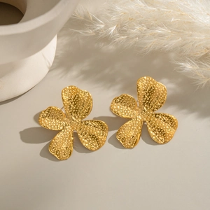 French vintage gold petal earrings with textured relief in elegant three-petal design