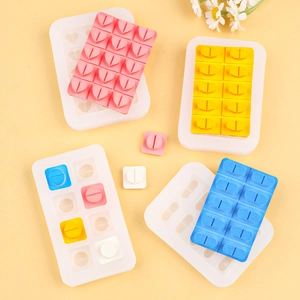 DIY silicone molds for heart and pill shaped chocolate or resin crafts on yellow background