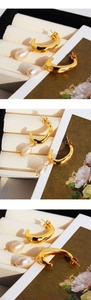 Detailed view of French vintage hammered C-shape earrings with elegant water drop pearls