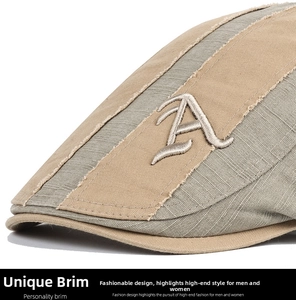 Close-up of contrast stitching and silver letter A embroidery on the visor of this flat cap