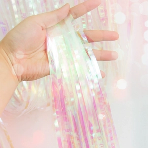 Iridescent pink and purple foil fringe curtain for party and wedding backdrop decoration