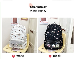 Student backpacks in white and black with cartoon dog prints and clear display pockets
