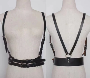 Front and back detail of black leather harness belt with dual straps and metal buckles