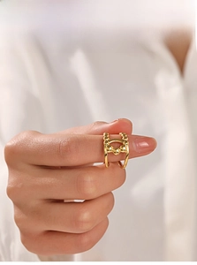 Detail shot of 18K gold plated double layer ring with five metal beads on finger