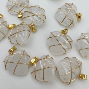 Handmade wire wrapped heart pendants in white quartz with elegant gold-tone wire finish