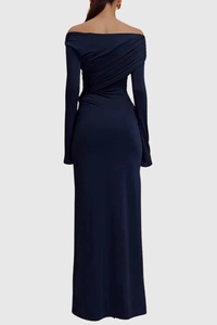 Detail view of the back pleats on a navy off-the-shoulder long sleeve evening gown