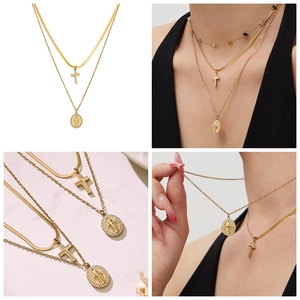 Detail of layered gold snake chain and O-chain with cross and Virgin Mary pendants