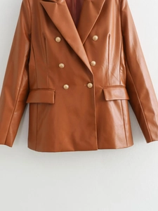 Detailed view of brown PU leather blazer featuring embossed gold buttons and double breasted style