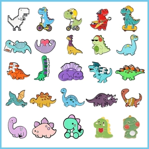 Macro shot of 25 cartoon dinosaur enamel pins with colorful rock and scholar themes