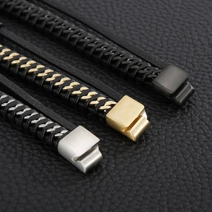 Detail of woven leather bracelets with magnetic clasps in black, gold, and silver finishes