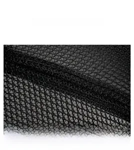 Detailed macro view of the breathable hollow mesh fabric and reinforced stitching of the cap