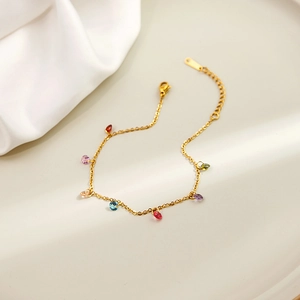 Detail of gold chain bracelet with colorful teardrop zircons and adjustable lobster clasp