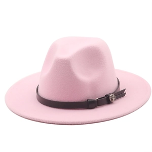 Detail of pink wool fedora with thin black leather band and silver floral metal buckle