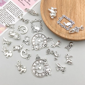 Detailed view of assorted antique silver zinc alloy rabbit pendants for DIY jewelry crafting