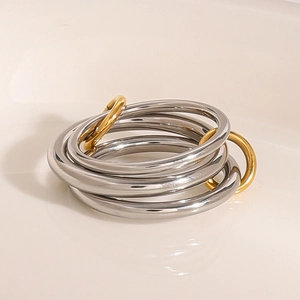 Minimalist multi-layered stainless steel ring with two golden link accents in silver finish