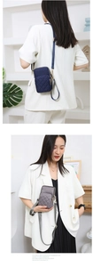 Quilted nylon crossbody phone bag shown on models in navy blue and charcoal grey