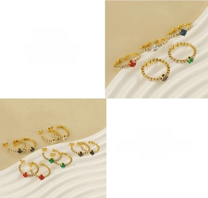 Detail of 18k gold plated titanium steel jewelry set with colorful square gemstones