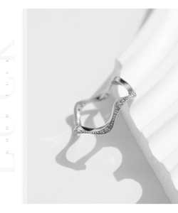 Macro shot of S925 sterling silver wavy ring with pavé-set cubic zirconia accents
