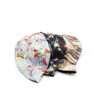 Three bucket hats with abstract botanical and fractal patterns for outdoor sun protection