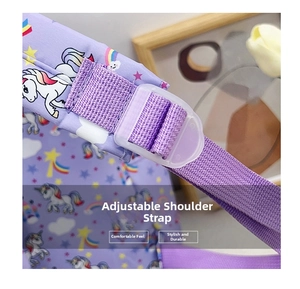 Close-up of adjustable shoulder straps with cute unicorn prints on a purple kids backpack