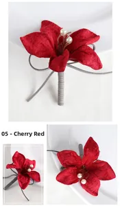 Detail of cherry red velvet wedding boutonniere with pearl stamen and grey corded stem
