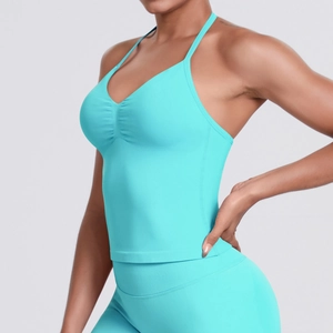 Detail of teal seamless yoga tank top with spaghetti straps and ruched chest design