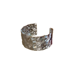 Minimalist silver metal open cuff bracelet featuring an irregular hammered texture surface