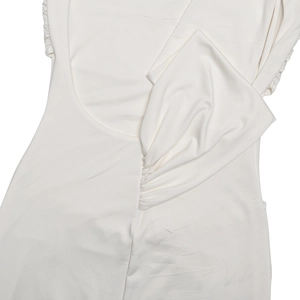 Close-up of white elegant sleeveless dress showing soft elastic fabric and side ruched detail