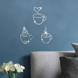 Detailed view of silver mirror coffee cup wall stickers on a modern blue living room wall