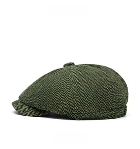 Side view of dark green herringbone newsboy cap with classic retro wool texture